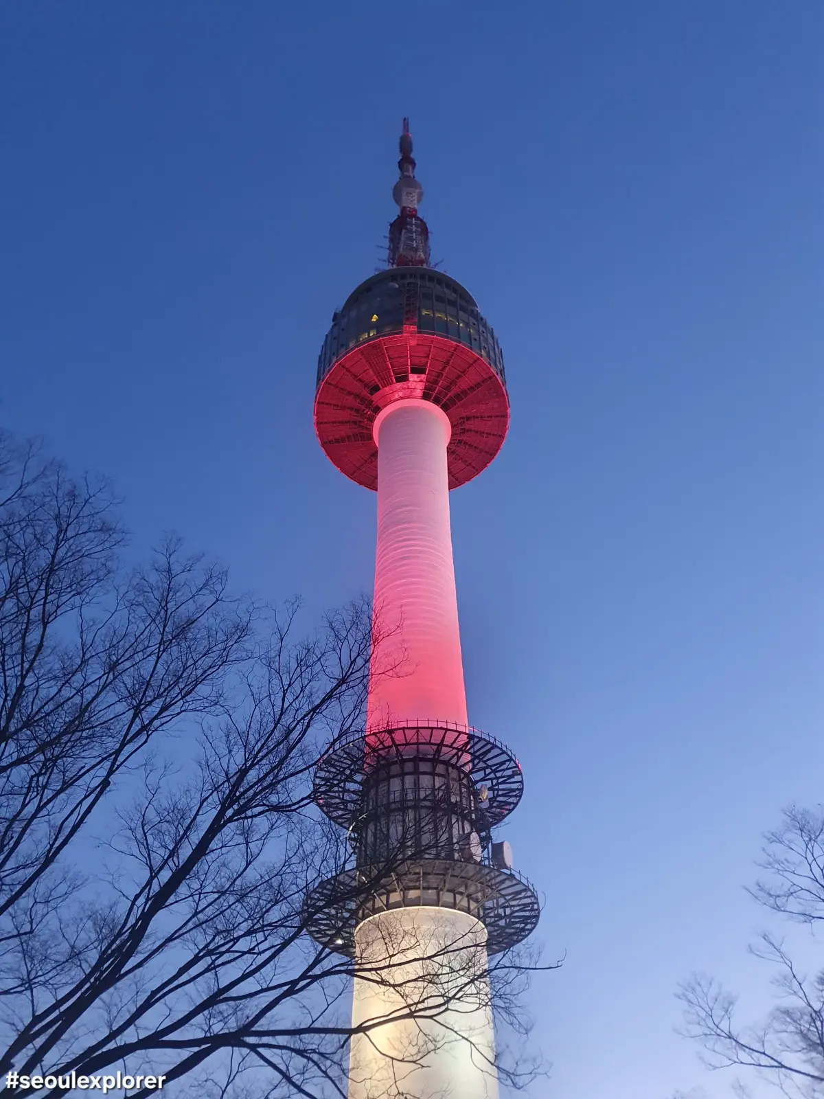 Namsan Seoul Tower glowing red due to poor air quality