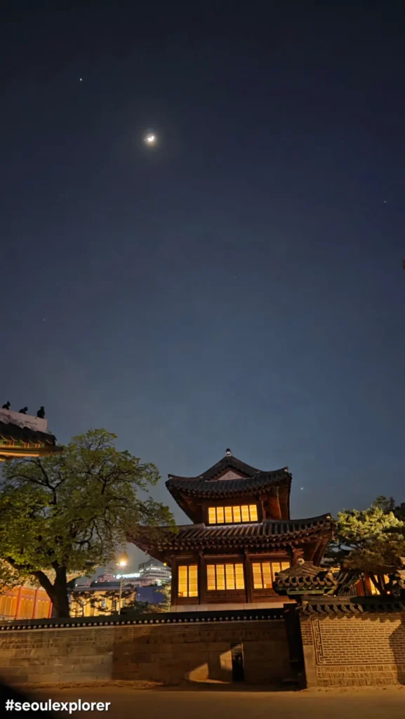 A traditional palace building with the moon