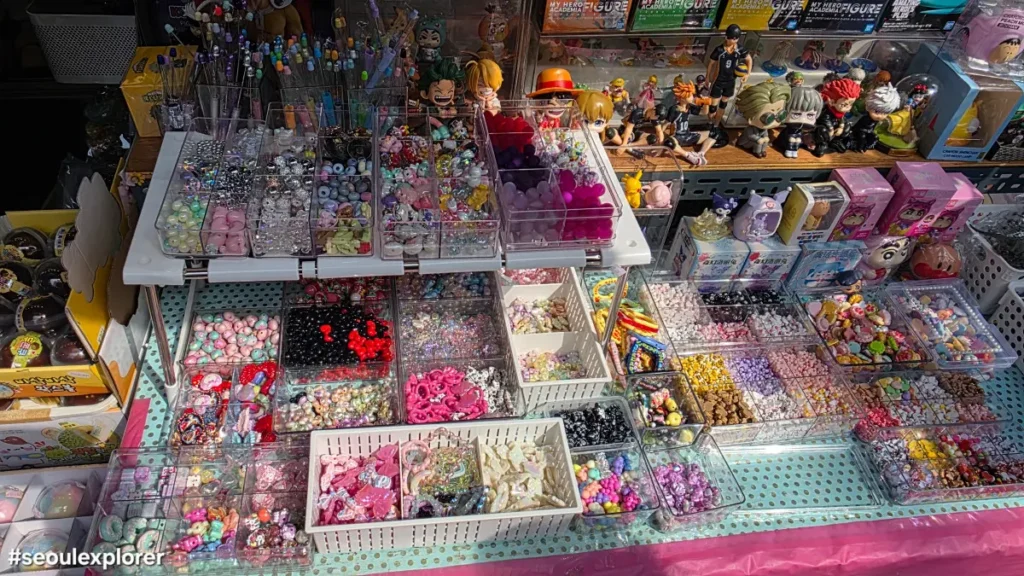 Colorful DIY beads and small stationery items displayed in transparent bins