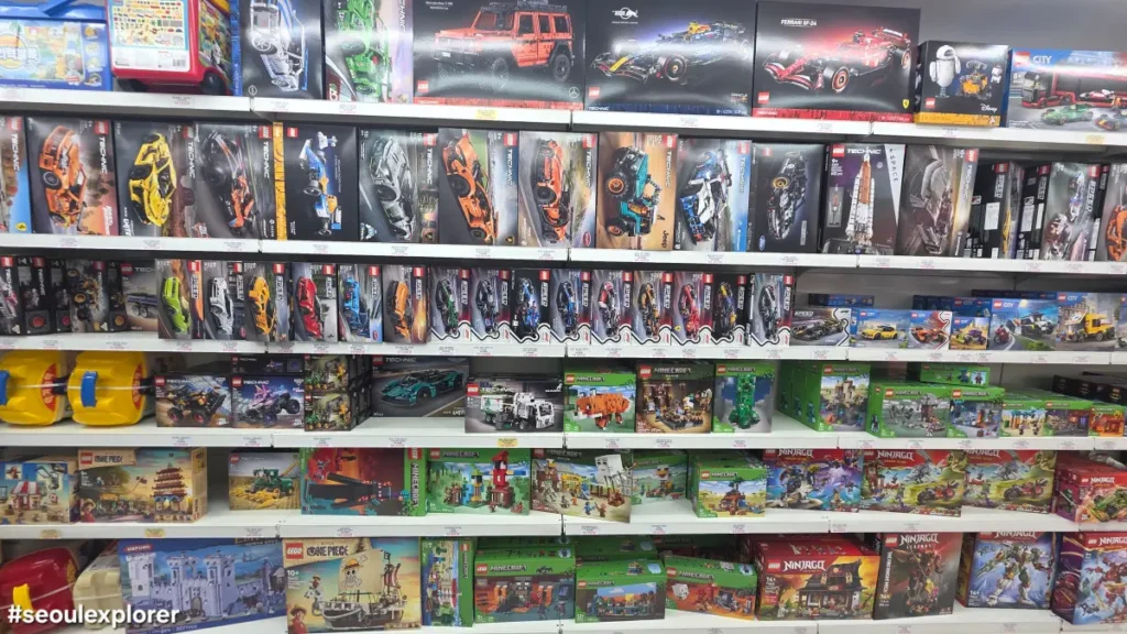 Shelves packed with various LEGO Technic and Speed Champions sets