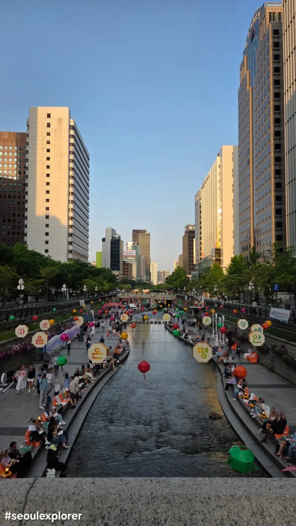 People relaxing along Cheonggyecheon Stream in Seoul
