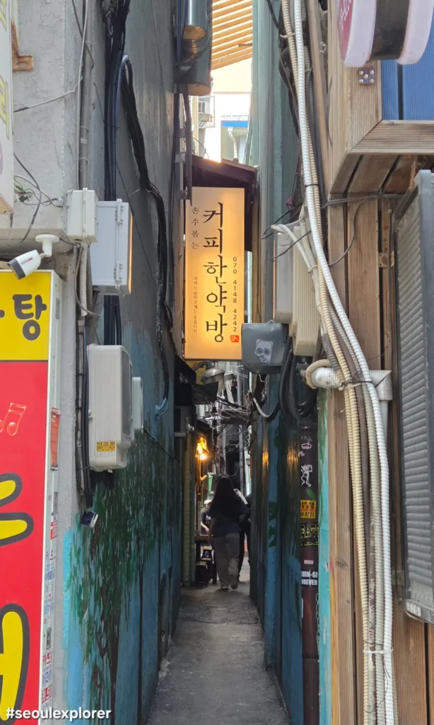 The narrow alleyway in Eulji-ro leading to the entrance of Coffee Hanyakbang