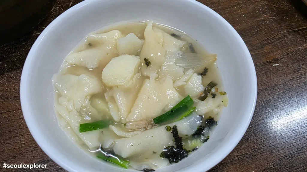 A bowl of warm Samcheongdong sujebi with potatoes