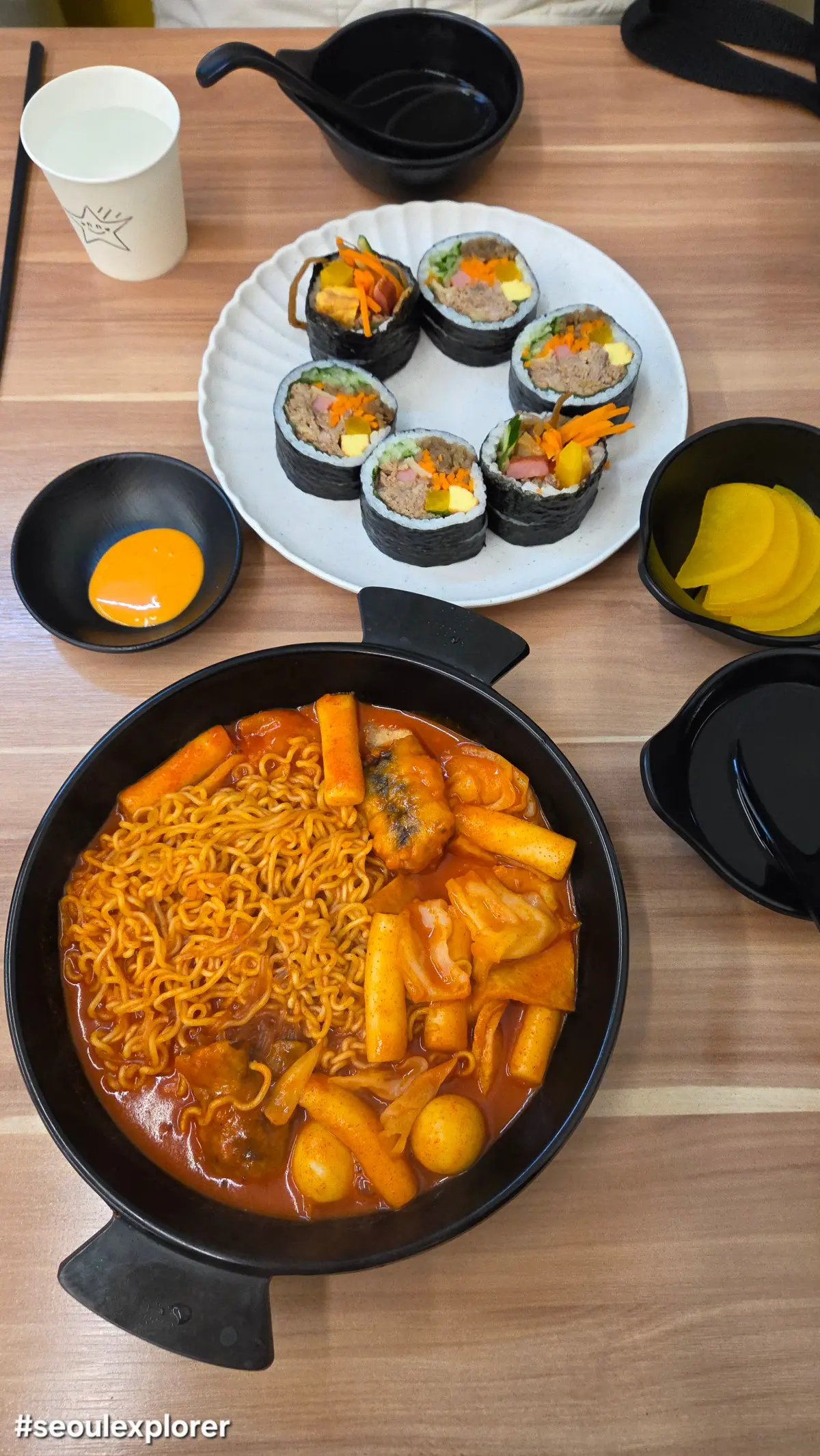 A table with tuna gimbap and rabokki at Tongtong gimbap