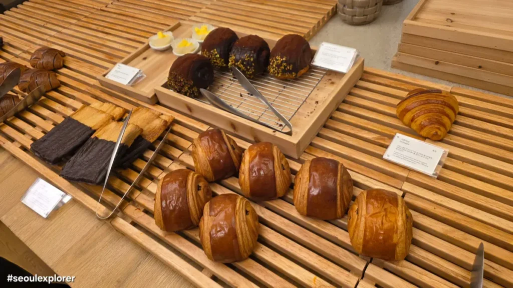 A variety of breads, including pastries, salt bread, and croissants